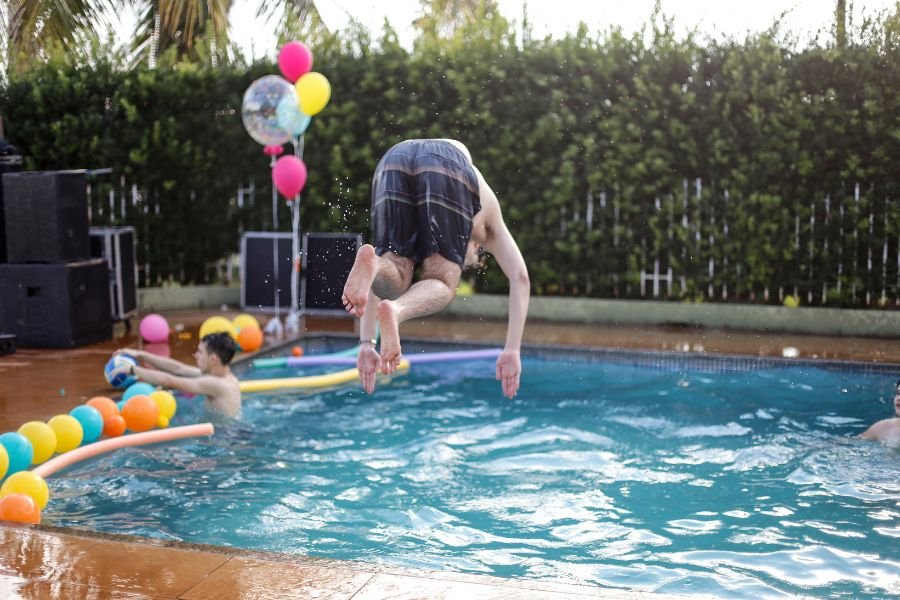 family enjoy swimming pool